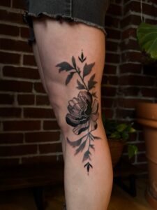 Floral knee tattoo women with peony petals